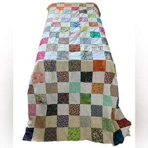 Patchwork multicolored quilt top